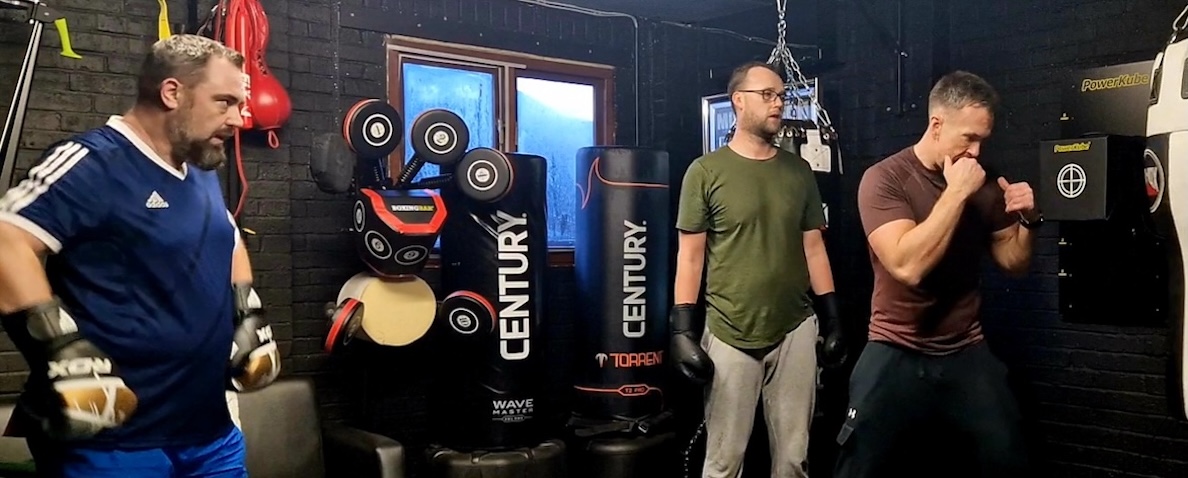 Group boxing class workout with Century punching bags at Boxing Fitness MK gym
