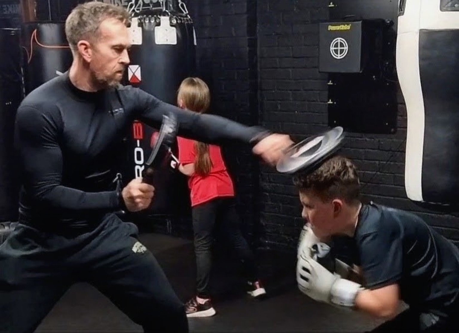 Young boxer being coached in defence and movement at The Boxing Room, Milton Keynes