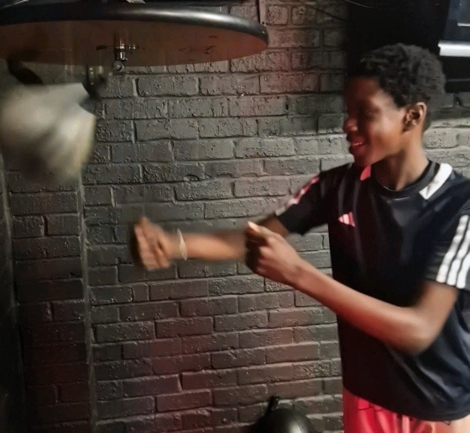 Youth boxer training on the speed ball during junior and youth boxing coaching in Milton Keynes