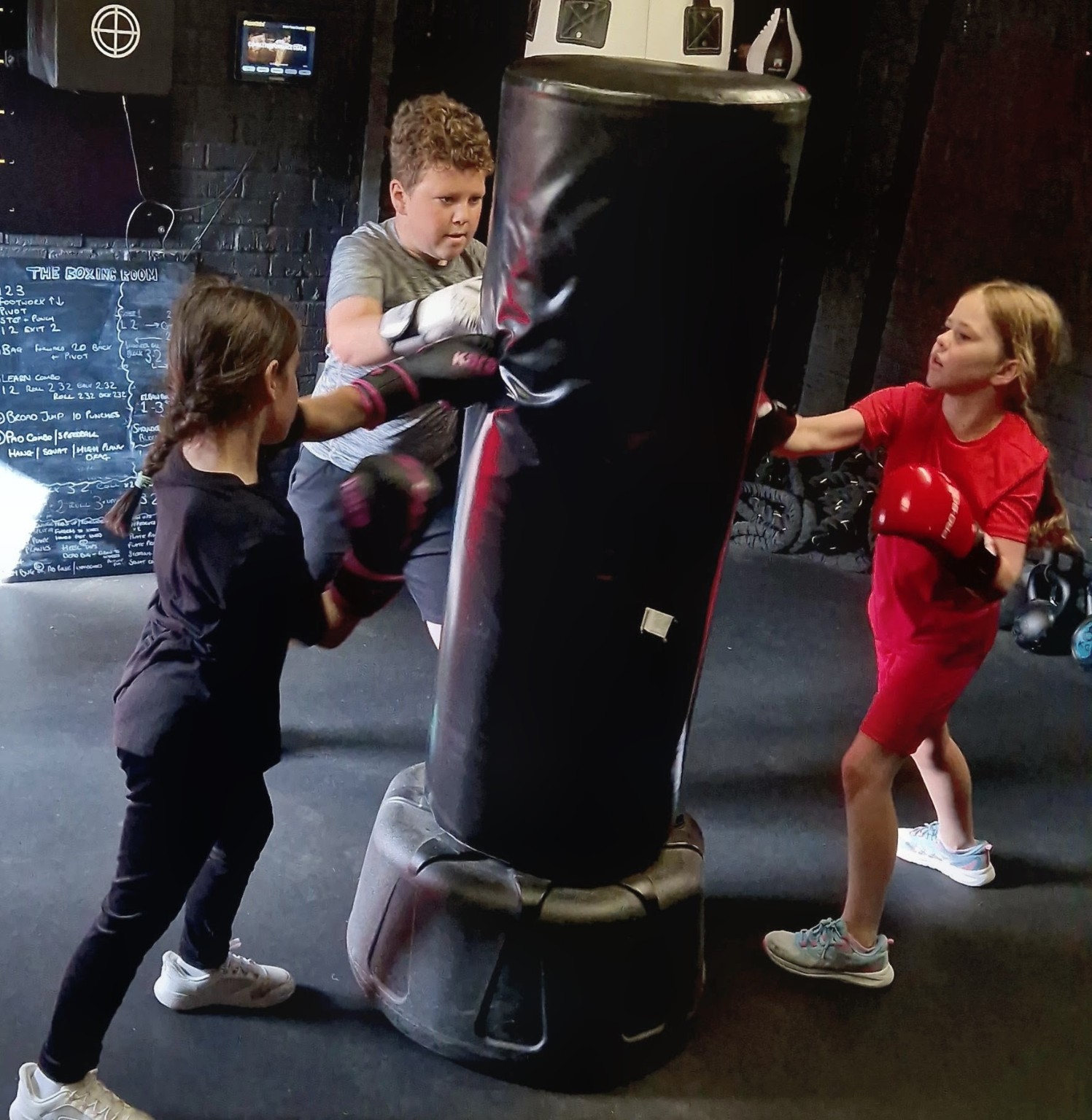 Small group of children in a non-contact junior boxing coaching session at The Boxing Room, Milton Keynes